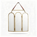 Tri-fold mirror with brass frame and leather strap for wall hanging 80 x 60 x 3cm